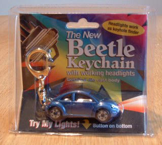 A New Beetle keychain with headlights that light up, from 2003.