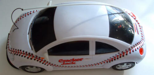 I won this rare toy on ebay.  The toy was a prize in a Cracker Jack contest (see wrapper).  I remember seeing the cardboard display in a US Walmart in 2001.  The grand prize was a real New Beetle with baseball glove leather seats by Rawling!